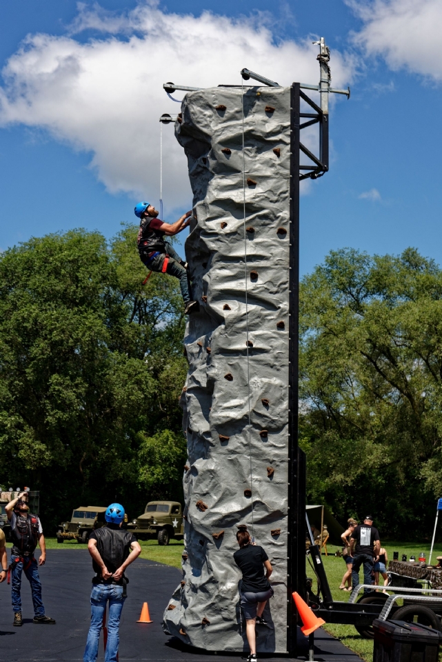 A brave soul accepts the Climbing Wall challenge.